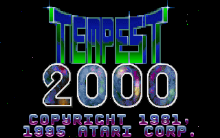 Explosions and particle effects fill the center of the web in Tempest 2000